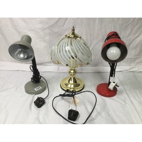 294 - Two adjustable lamps and a brass lamp with glass shade