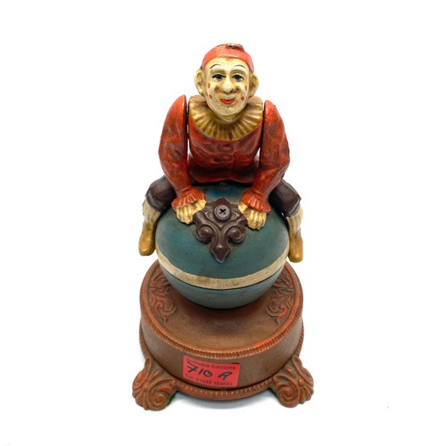 710A - Clown on globe cast iron mechanical bank reproduction spinning acrobat 25cm high