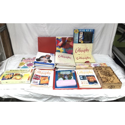 318 - A quantity of colouring books and pastels/pencils with books on calligraphy(handwriting styles)