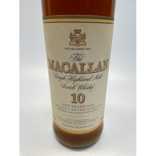 1053 - Two bottles of whiskey including MacAllan and Famous Grouse