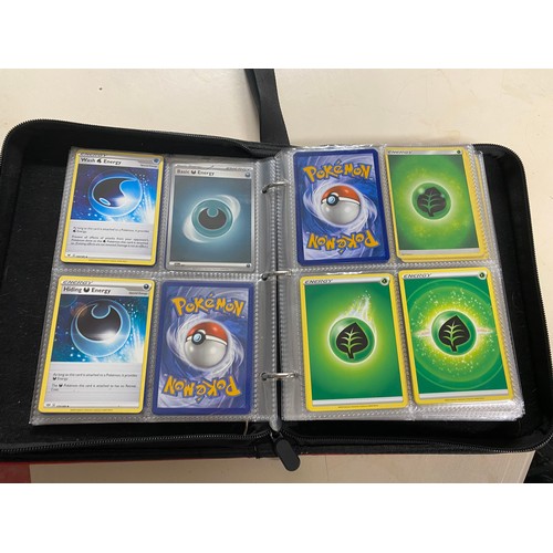 606 - Collection of pokemon cards, tins and collectors book.