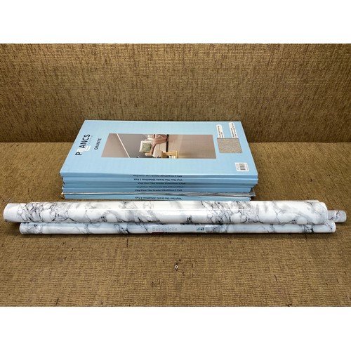 25 - 6 packs of granite peel and stick flooring 304mm x609mm and 4 rolls of self adhesive film.