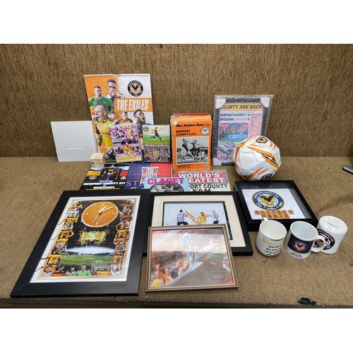 41 - Collection of Newport County FC memorabilia including: A Football, clock and DVDs.