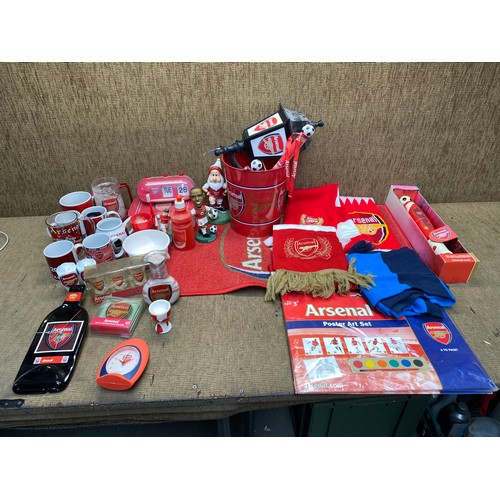 61 - Mixed items of arsenal fc including mugs, clocks, posters and arsenal fc scarfs.