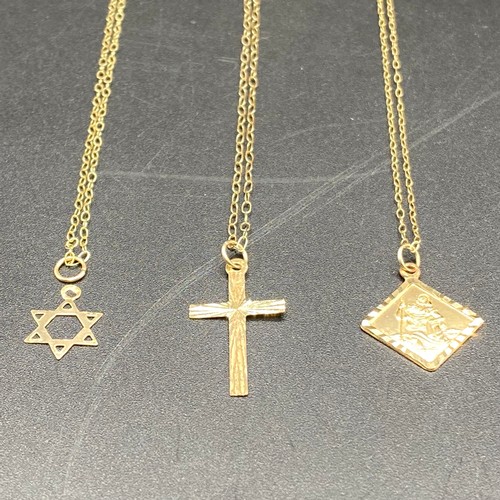 812 - 9ct gold Star of David pendant and chain, 9ct gold cross and chain and a 9ct gold chain with Saint C... 