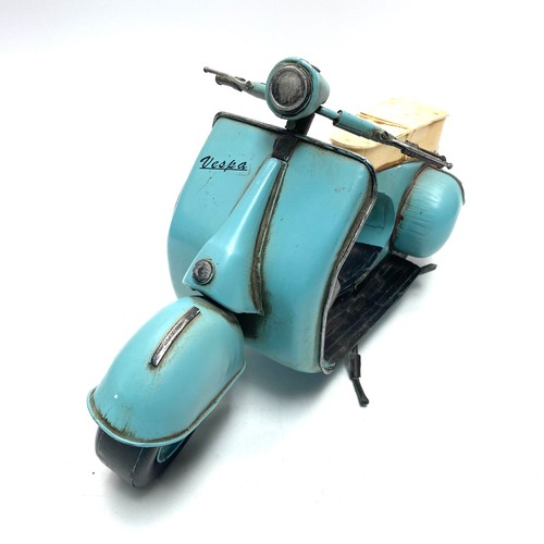 634 - Tin vespa scooter; 40cm length.