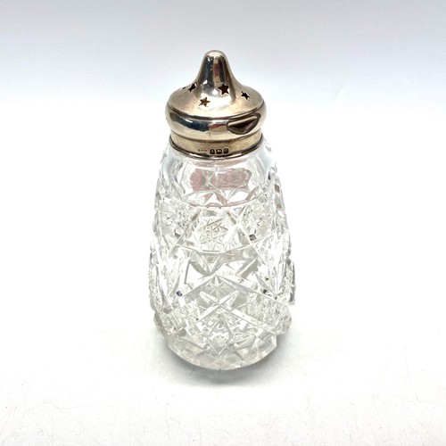 636 - Antique crystal sugar shaker with hallmarked silver top and inner rim.