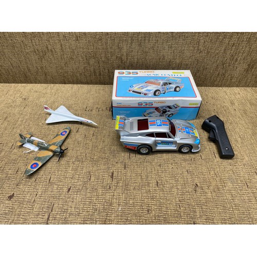 645 - Porsche 936 turbo RC car, Dinky toys spitfire mark II and Corgi concord.