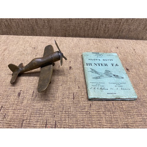 646 - WWII model bronze British fighter plane and Hunter F.6 pilots notes.