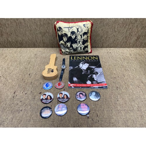 653 - Collection of The Beatles memorabilia: Cushion, Watch and Badges.