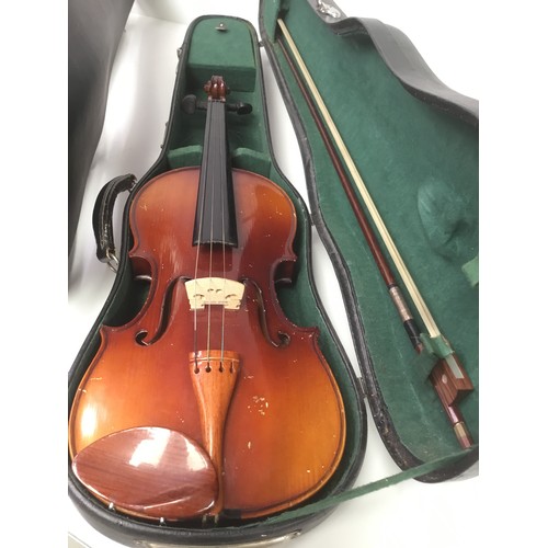 140 - Two violins with bows and cases