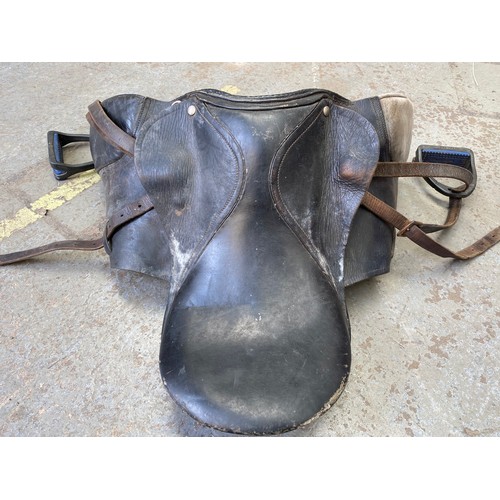 168 - Horse equipment, saddlery and saddlery making equipment including: Black leather saddle and stirrups... 