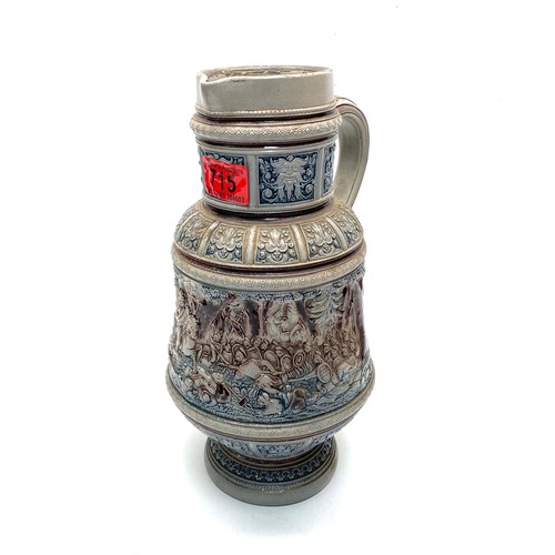 715 - Vintage German pottery stein; 32cm tall.