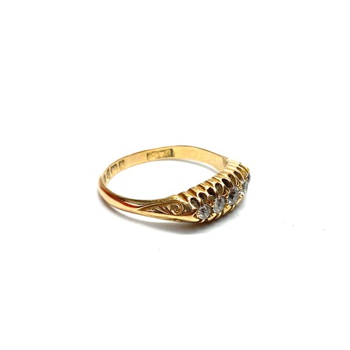 897 - 18ct Gold ring with five graduated diamonds 4g size Q.