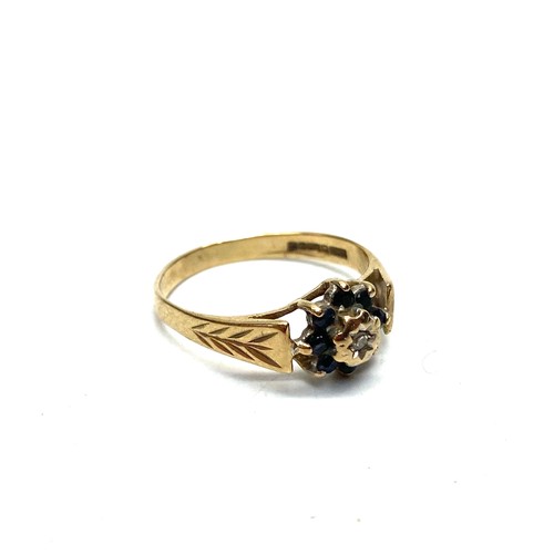 901 - 9ct gold ring with sapphires and a diamond. 1.6g and size L.