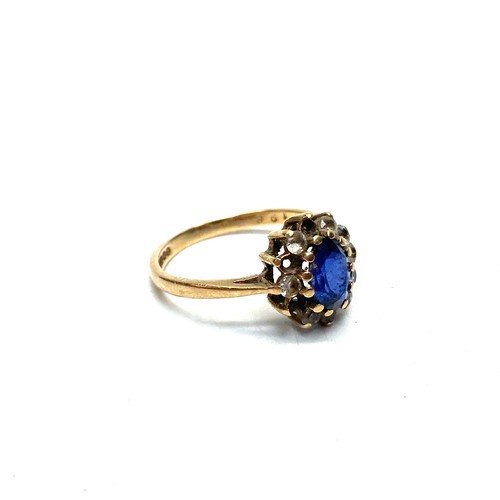 903 - 9ct gold cluster ring with large sapphire (three smaller stones missing) 2.3g and size M.