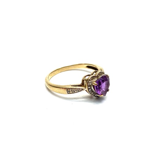 906 - 9ct gold heart-shaped ring with Amethyst and diamonds. 1.7g and Size K.