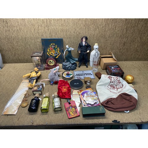 1132 - Collection of Harry Potter collectibles including: Dobby with a sock and Tom Riddles' diary, Feather... 