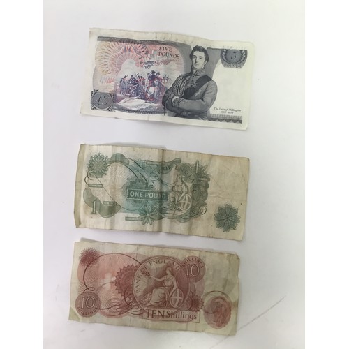 929 - Three old English banknotes including a five pound note