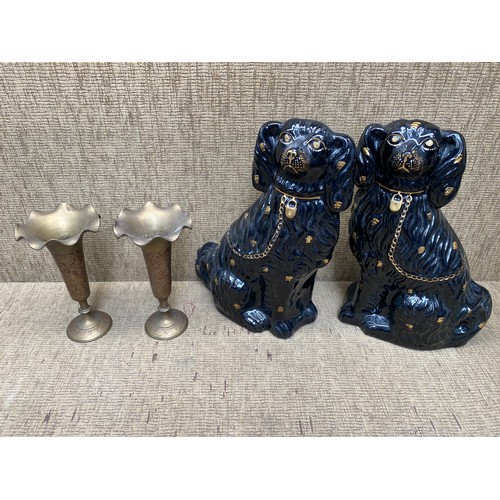 504 - 2 fire side dogs and a pair indian candle holders.