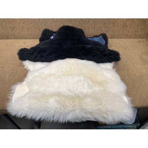 505 - 2 sheep skin rugs white and black 90x60cm