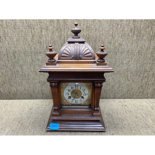 1150F - Large antique carved walnut brass face eight day bracket clock; 48cm tall.