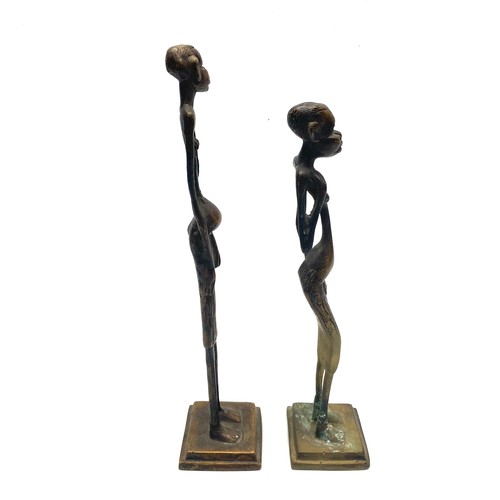 942 - African bronze elongated sculpture statue; 30cm.