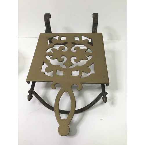 519 - Cast iron and brass kitchen trivet and a brass hanging light shade with glass