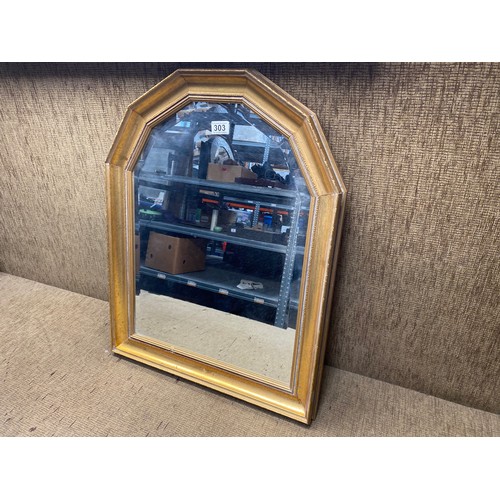 303 - Gold framed bevel edged mirror; 74cm x 56cm.