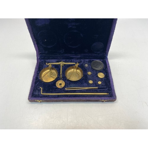 671 - Stunning set of brass miniature scales in a velvet box.