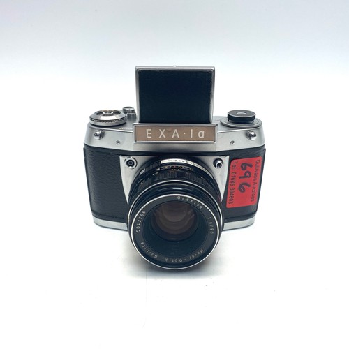 696 - 2 EXA.LA film camera 1 with E. Ludwig 1283871 Meritar 50mm lens.