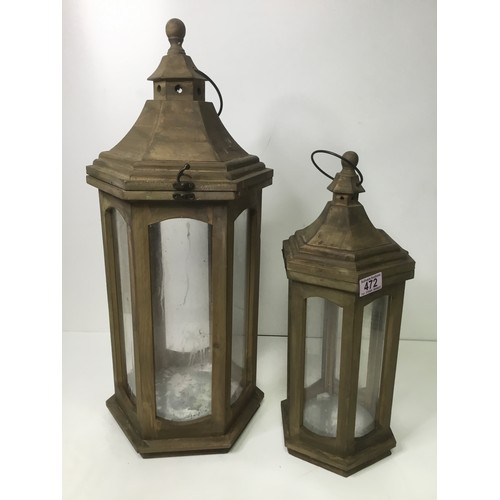 472 - Two wooden candle lantern lights largest 65cm