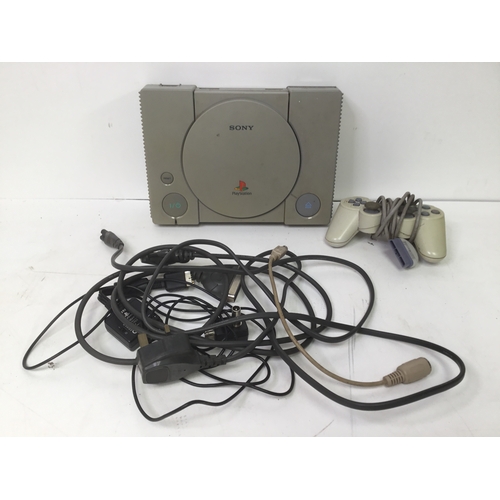 1148 - Sony PlayStation with leads and controller