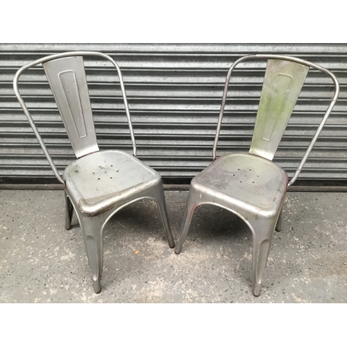 1152 - A pair of Tolix metal chairs