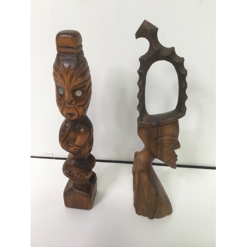 621 - Two hand carved tribal figures 26cm