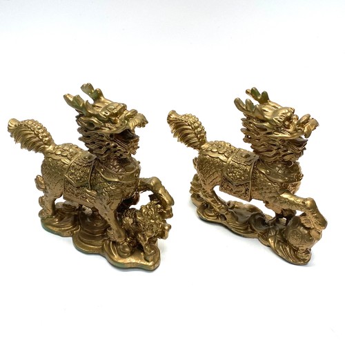 631 - Pair of gold painted resin temple guardians.