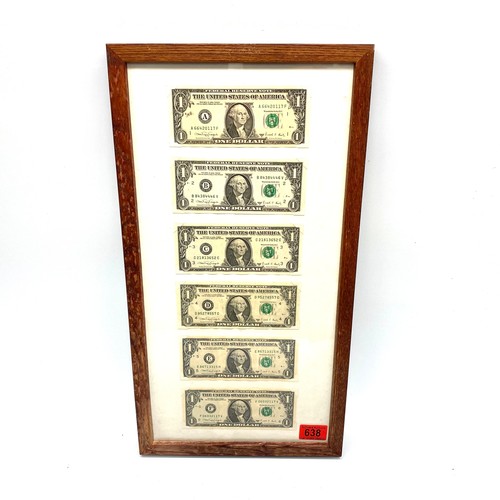 638 - Collection of six consecutive star US 1 one dollar notes in a frame.