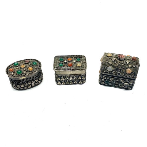 652 - 3 white metal trinket boxes with semi-precious stones.