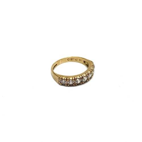 853 - 9ct gold ring with CZ stones, size J, 2.00g.