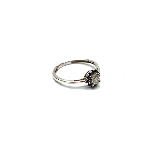 873 - White metal ring (tests as white gold no hallmarks as the ring has been resized) with a diamond. Siz... 