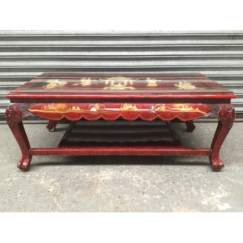 687 - Chinese red lacquer coffee table 103cm x 51cm