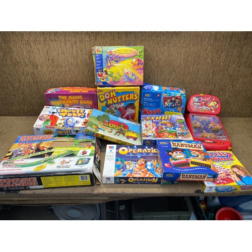 105 - mixed selection of family games including guess who,  operation and hangman.