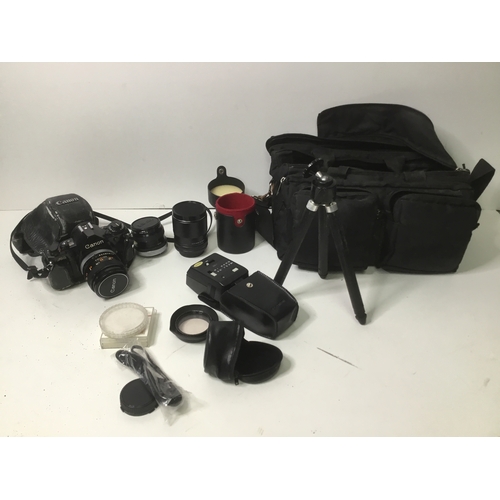 886 - Canon A1 35mm film camera with accessories and storage bag