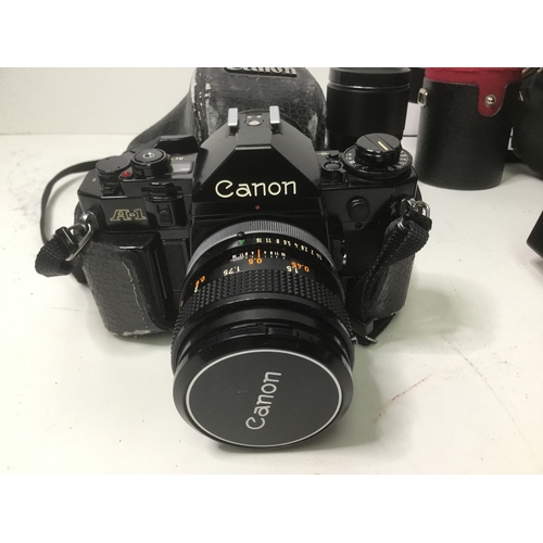 886 - Canon A1 35mm film camera with accessories and storage bag