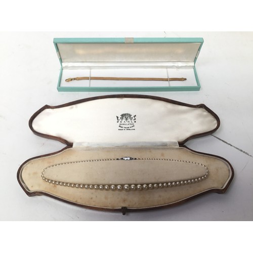 897 - Silver gilt herringbone bracelet and a simulated pearl necklace in original box