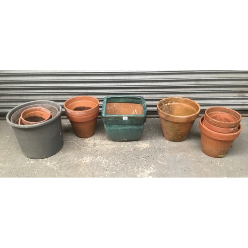 145 - A selection of garden plant pots including terracotta