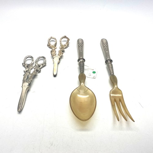 924 - Silver Handled large serving spoons and two sets of silver-plated grape shears.