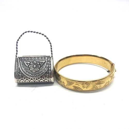 928 - Silver small purse (lid hinged and lifts) and 9ct rolled gold bangle.