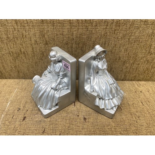 494 - pair of silver painted bookends.