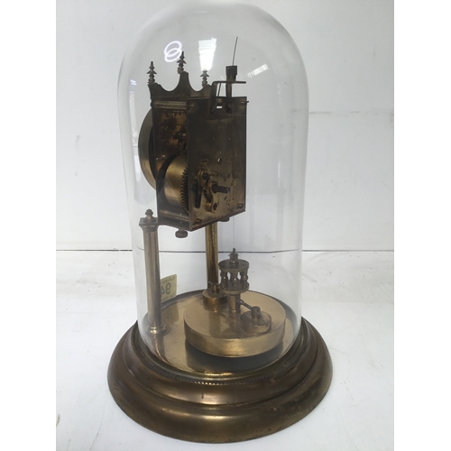 943 - glass domed clock torsion clock working when booked in